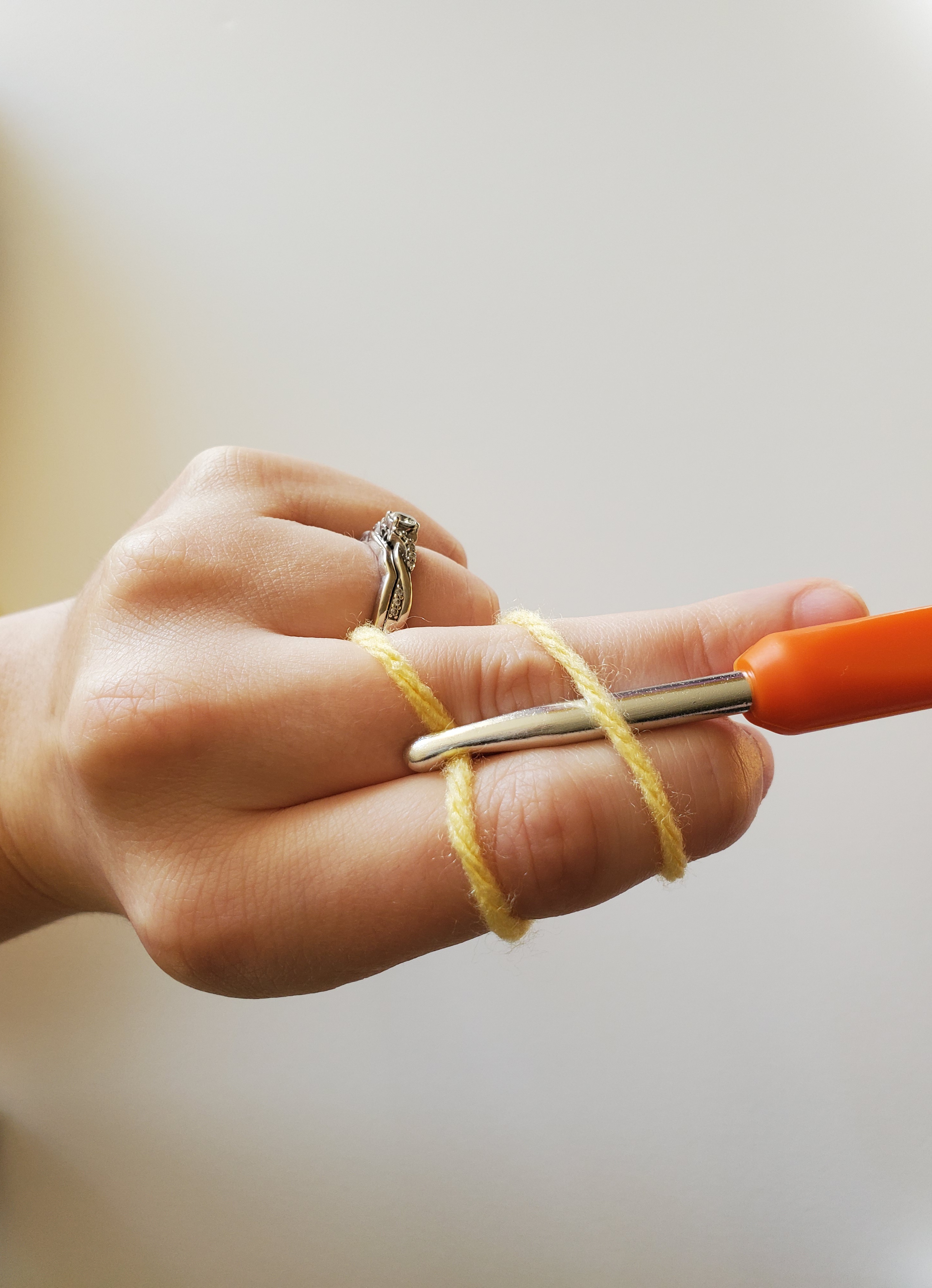 Grabbing the second yarn strand with crochet hook