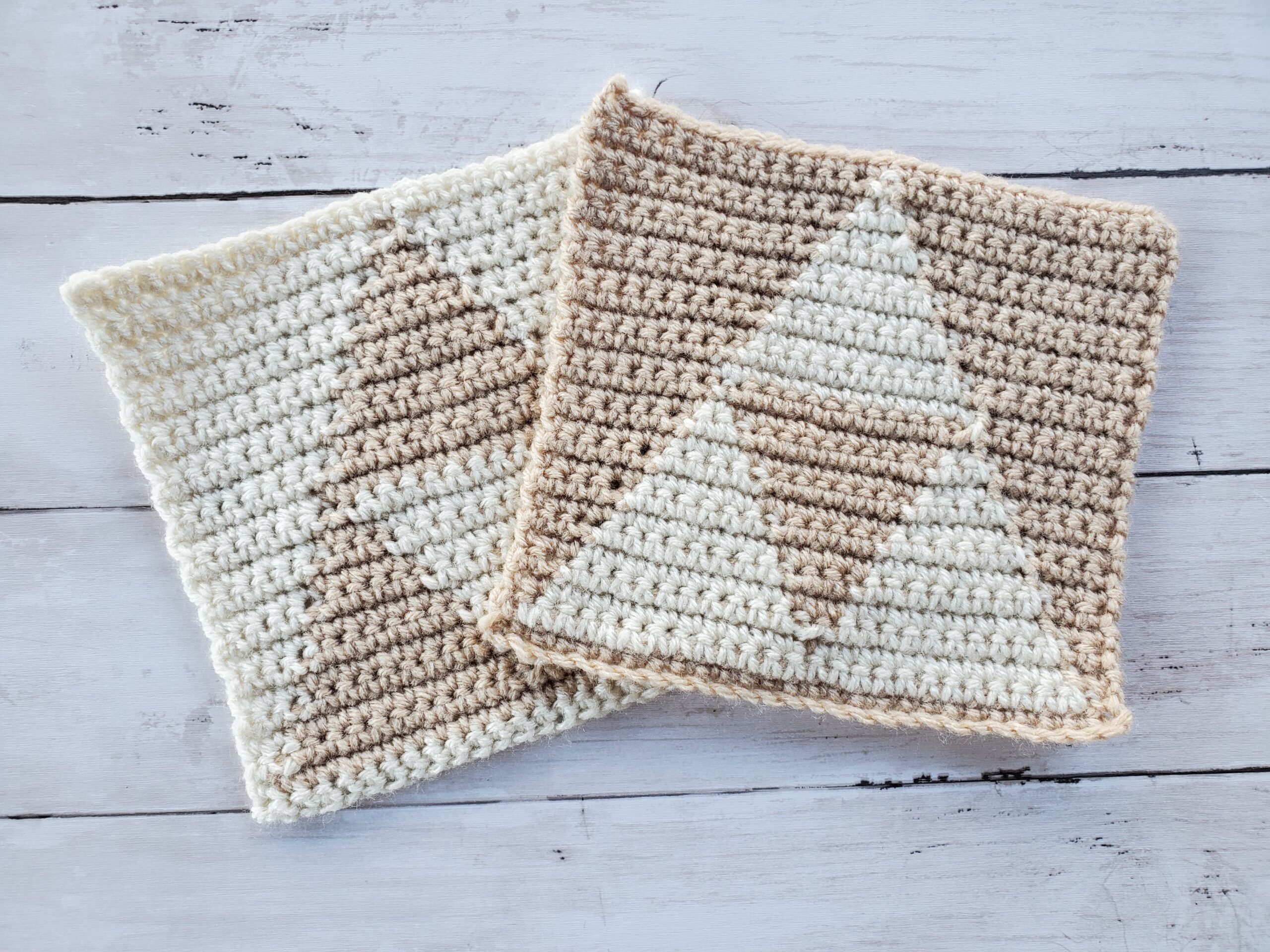 Two triforce dishcloths in Aran and Buff yarn
