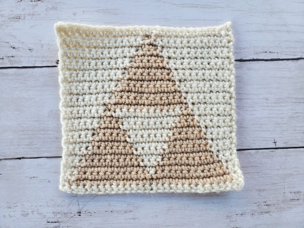 Triforce dishcloth with aran base color and buff triforce color