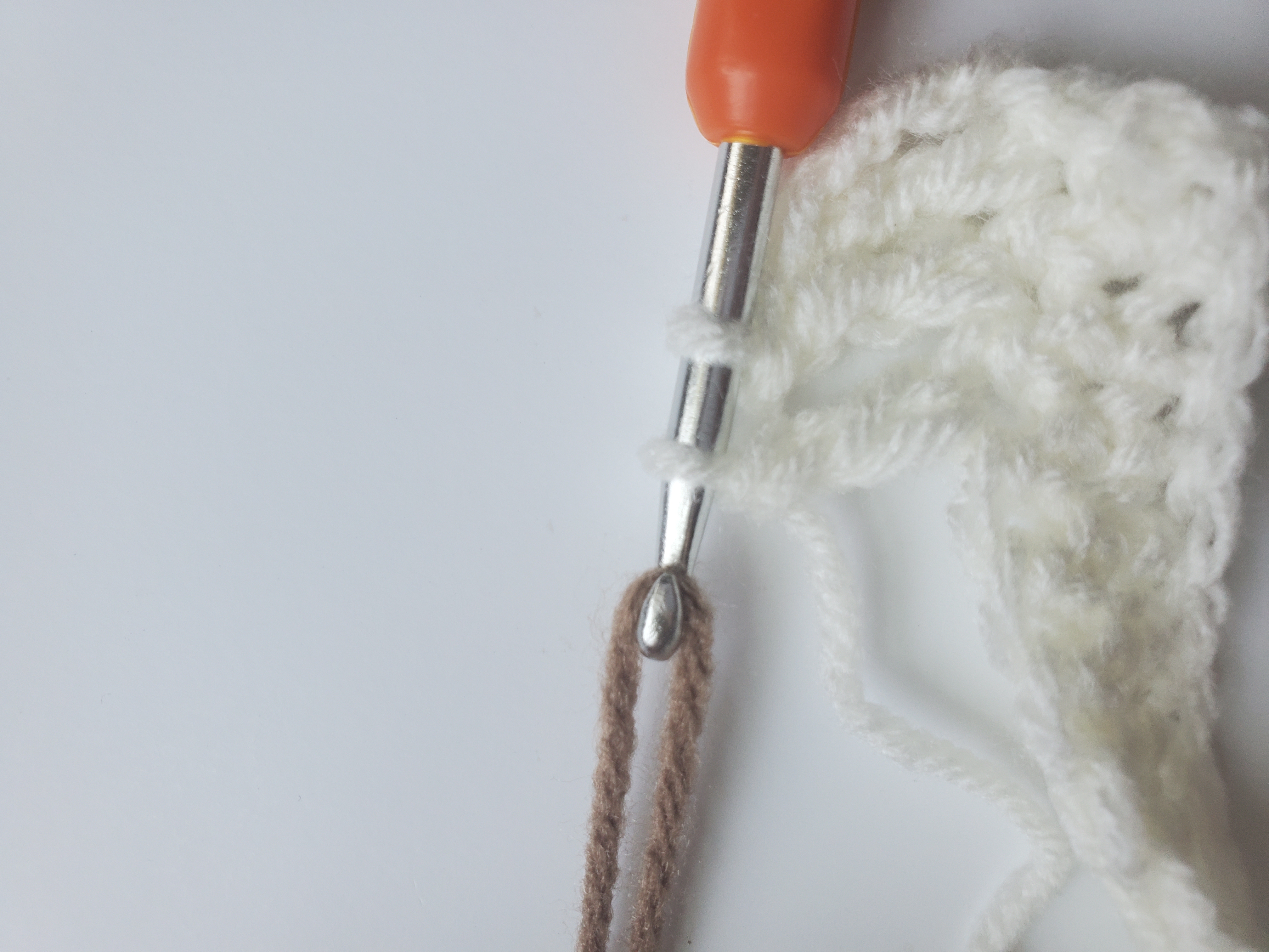 Attach yarn at top of triple crochet stitch