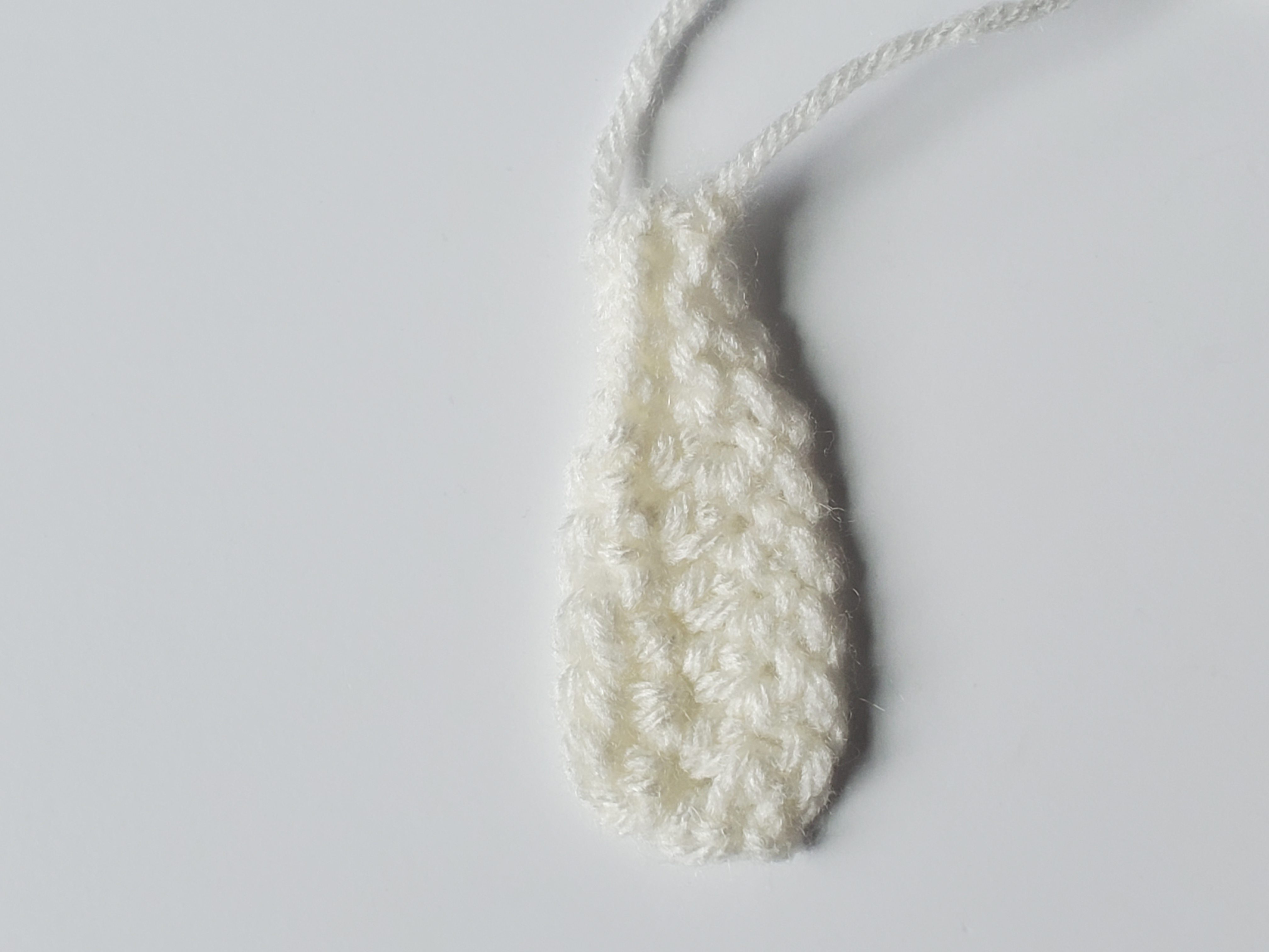 Belly of whale in soft white yarn