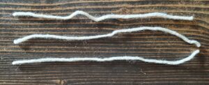 3, 8 inch strands of aran yarn for fringe